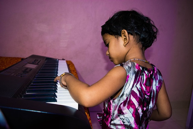 Young girl playing piano