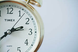 Partial pic of Timex analog clock with alarm bell