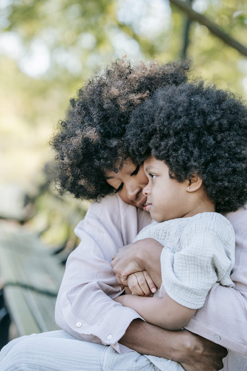 a mother hugging her child